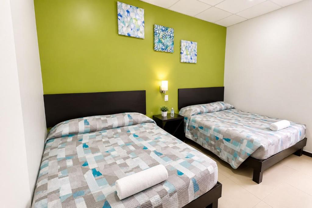 Bright guest room with two beds at Hotel Plazha Express
